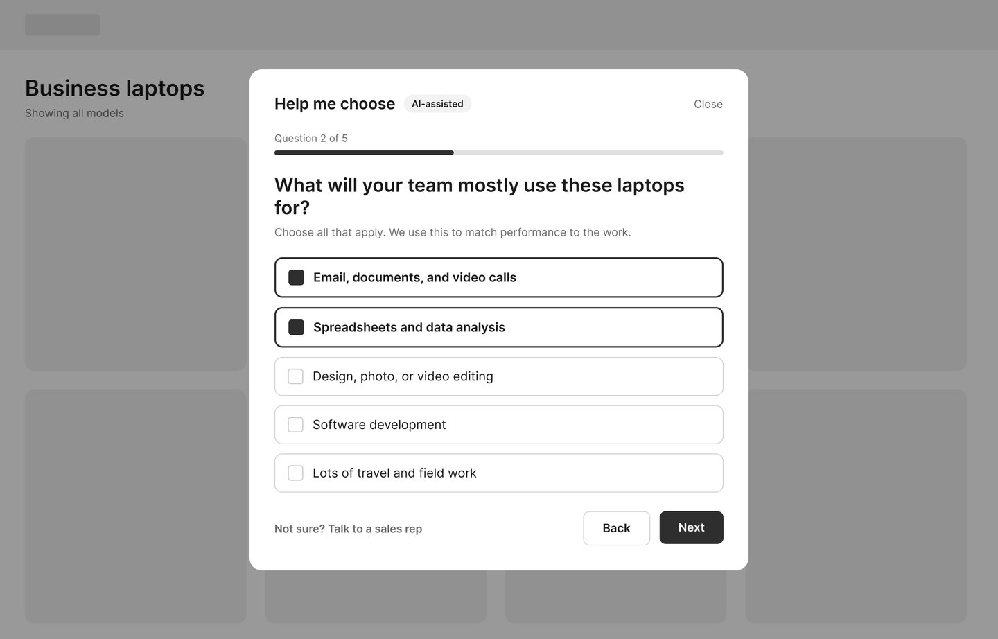 Wireframe: a question step asking what the team will use the laptops for, with checkbox answers and a question 2 of 5 progress bar